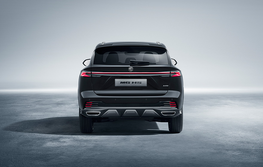 Sporty Rear<br/>The rear design emphasizes sportiness, with a large rear spoiler and dualexhaust outlets highlighting its athletic character.